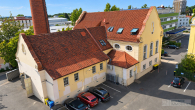 Vollvermietetes Industriedenkmal in Nürnberg – saniertes Maschinenhaus mit historischem Wahrzeichen - Drohnenaufnahme